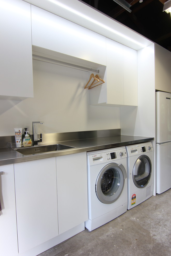 This is an example of a contemporary laundry room in Other.