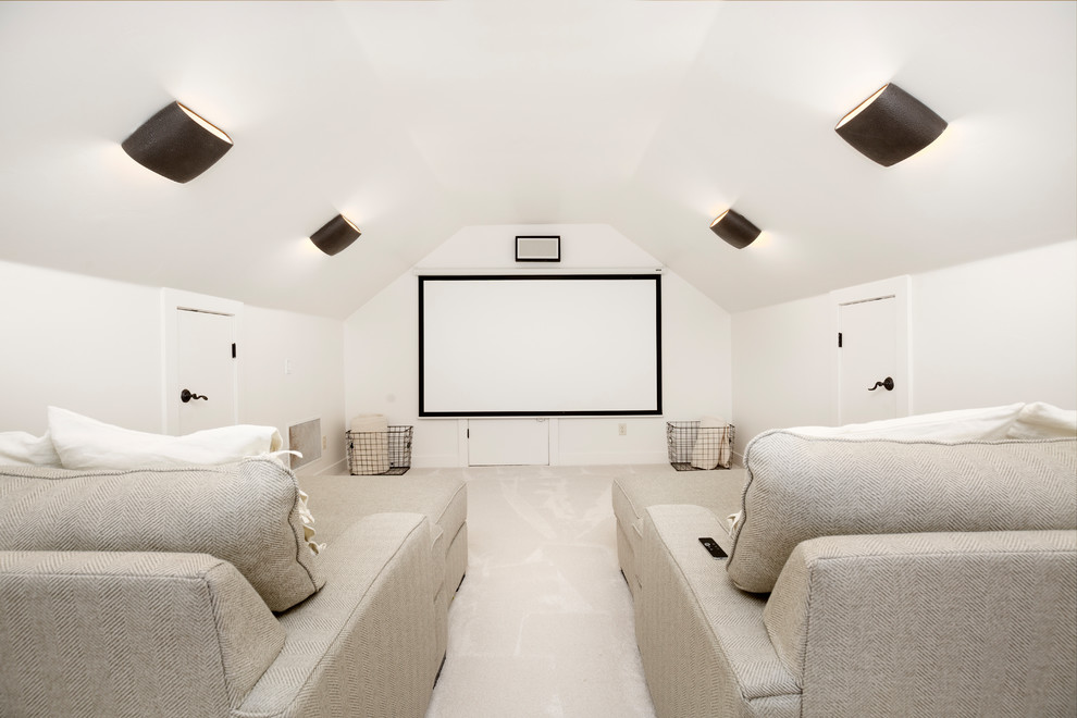 Photo of a mid-sized transitional enclosed home theatre in Salt Lake City with white walls, carpet, a projector screen and beige floor.