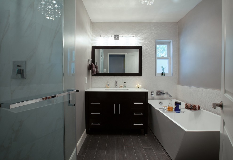 Example of a mid-sized minimalist porcelain tile bathroom design in Los Angeles with flat-panel cabinets and dark wood cabinets