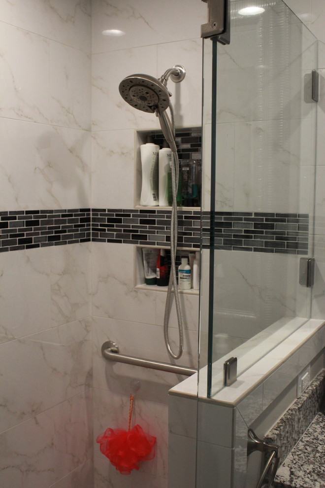 Small transitional master white tile and porcelain tile porcelain tile and gray floor bathroom photo in Houston with shaker cabinets, gray cabinets, gray walls, granite countertops and a hinged shower door