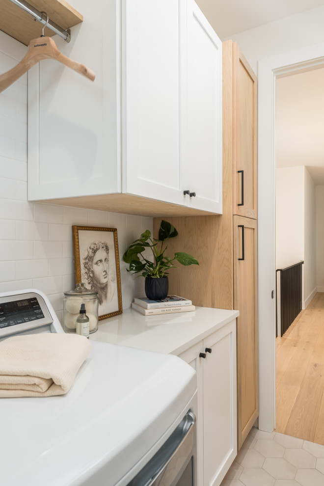 Transitional laundry room photo in Tampa