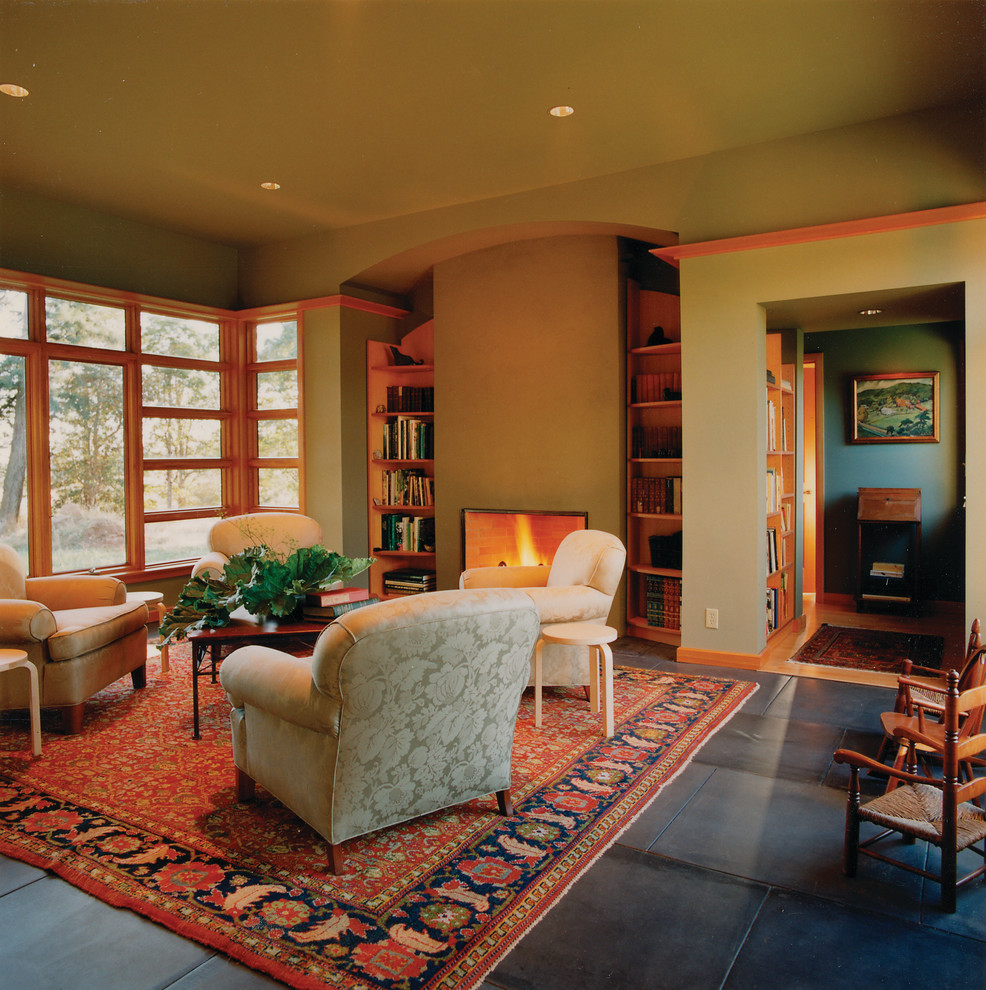 Inspiration for a mid-sized contemporary formal open concept living room in Portland with green walls, slate floors, a standard fireplace and no tv.
