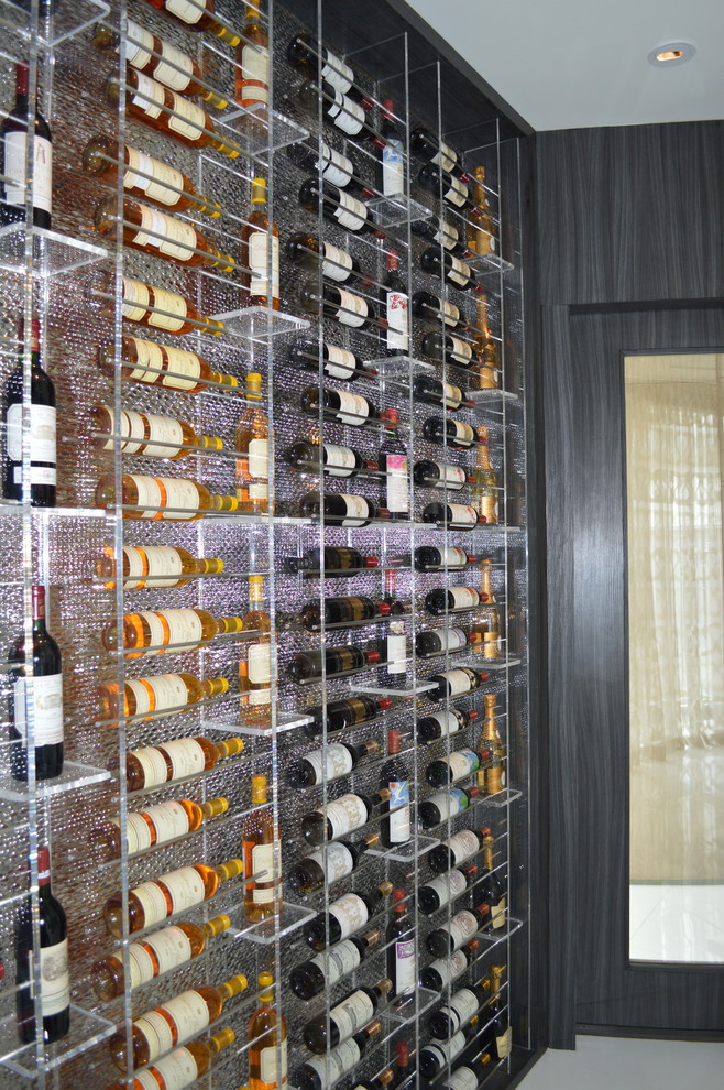 Design ideas for a mid-sized modern wine cellar in Los Angeles with marble floors and display racks.