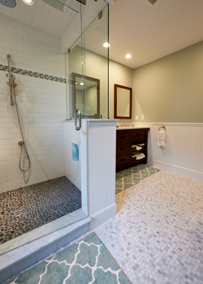 Design ideas for a mid-sized country master bathroom in Portland Maine with flat-panel cabinets, dark wood cabinets, a corner shower, white tile, subway tile, green walls, ceramic floors, an undermount sink and granite benchtops.