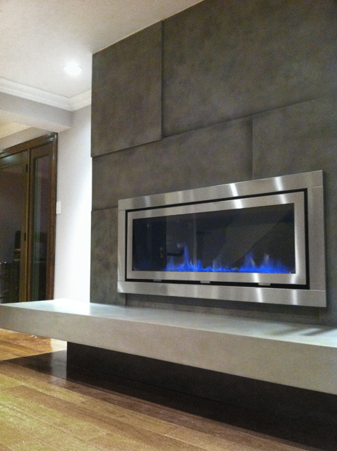 This is a side shot of the fireplace surround that show the dimension to the concrete panels and the floating hearth.