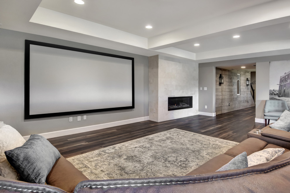 Inspiration for a large industrial home theatre in Denver with grey walls, vinyl floors and brown floor.