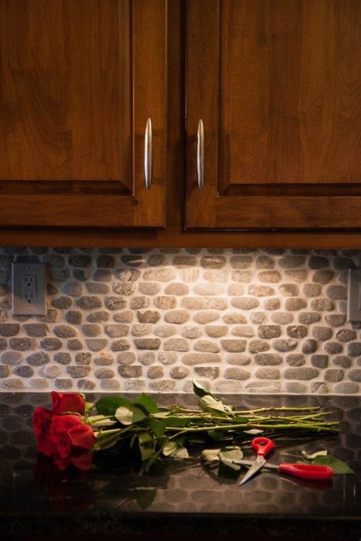 Example of a transitional kitchen design in Atlanta with raised-panel cabinets and medium tone wood cabinets