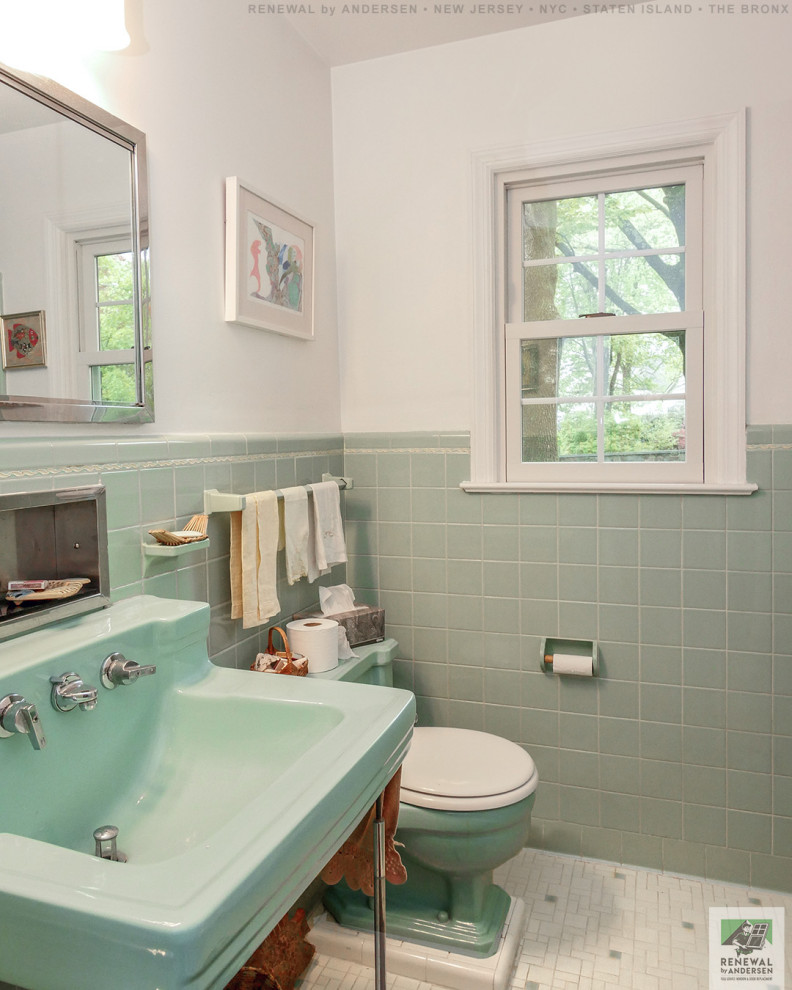 Photo of a mid-sized bathroom in New York with open cabinets, an alcove tub, a shower/bathtub combo, a two-piece toilet, green tile, ceramic tile, white walls, ceramic floors, an integrated sink, solid surface benchtops, white floor, a shower curtain, green benchtops, a single vanity, a built-in vanity and vaulted.