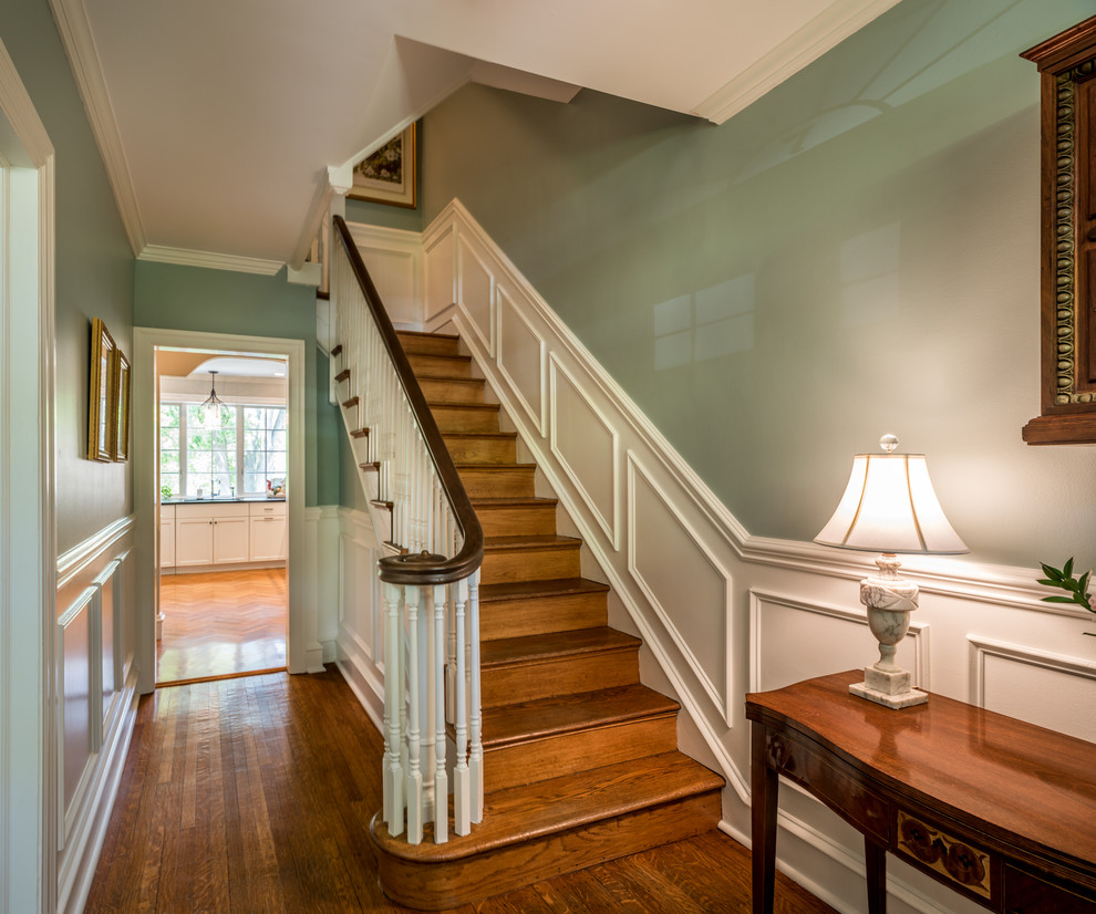This is an example of a small traditional foyer in Philadelphia with green walls and medium hardwood floors.