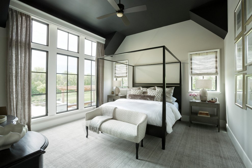Inspiration for an expansive transitional master bedroom in Minneapolis with beige walls and carpet.