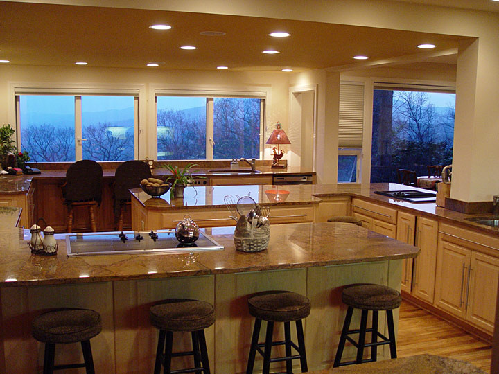 Inspiration for a large transitional l-shaped light wood floor open concept kitchen remodel in Charlotte with a double-bowl sink, raised-panel cabinets, light wood cabinets, marble countertops, stainless steel appliances and an island