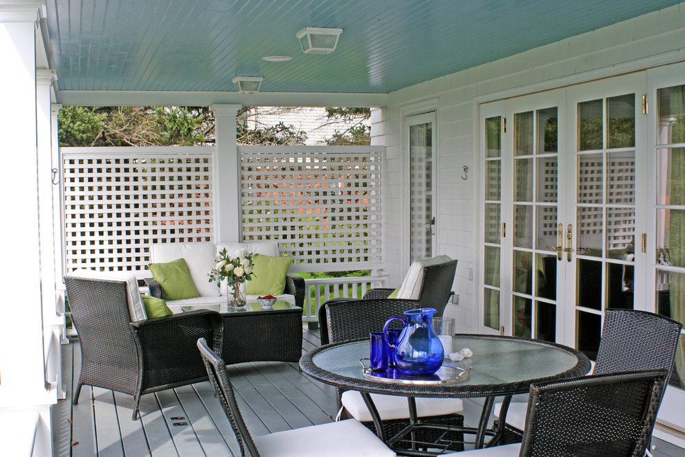 This is an example of a small traditional front yard verandah in Providence with decking.