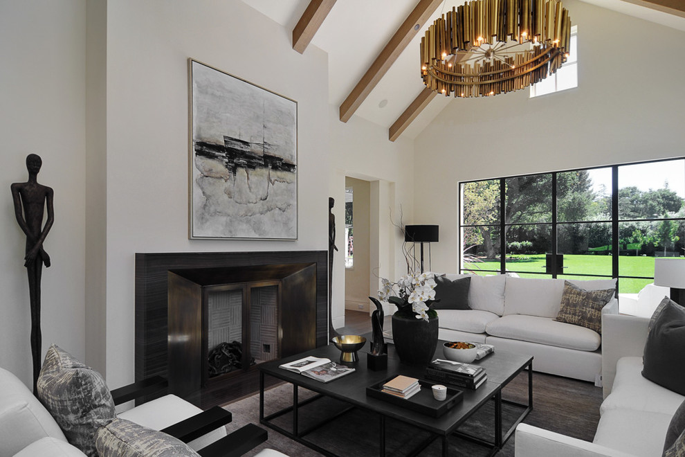 Design ideas for a transitional formal enclosed living room in Los Angeles with white walls and a standard fireplace.