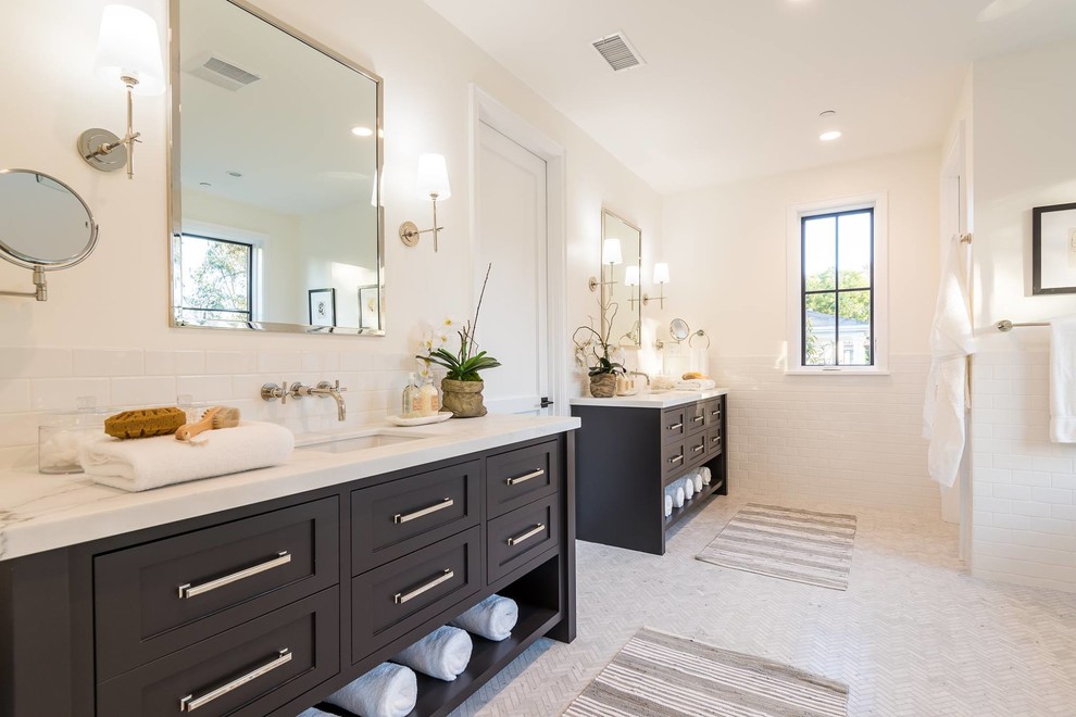 This is an example of a transitional master bathroom in Los Angeles with shaker cabinets, black cabinets, white tile, subway tile, white walls, marble floors, an undermount sink, white floor and white benchtops.