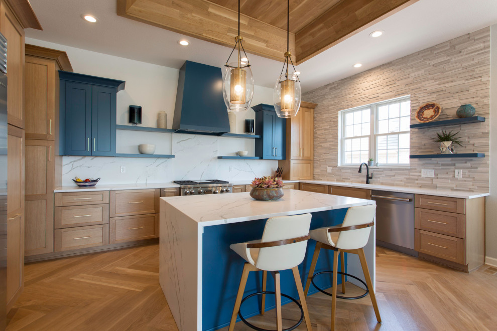 Inspiration for a large retro u-shaped open plan kitchen in Denver with a submerged sink, shaker cabinets, blue cabinets, engineered stone countertops, white splashback, engineered quartz splashback, stainless steel appliances, light hardwood flooring, an island, brown floors, white worktops and a wood ceiling.