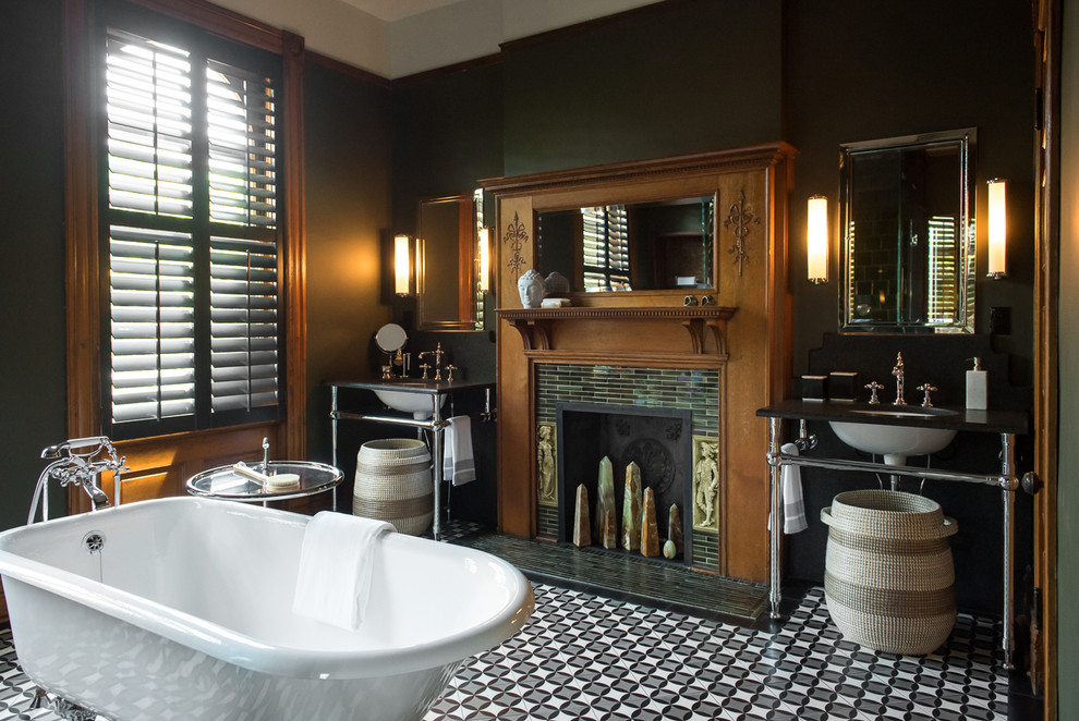 Design ideas for a large traditional master bathroom in St Louis with a claw-foot tub, an open shower, a one-piece toilet, green tile, ceramic tile, green walls, cement tiles, a console sink, granite benchtops, multi-coloured floor, a hinged shower door and black benchtops.