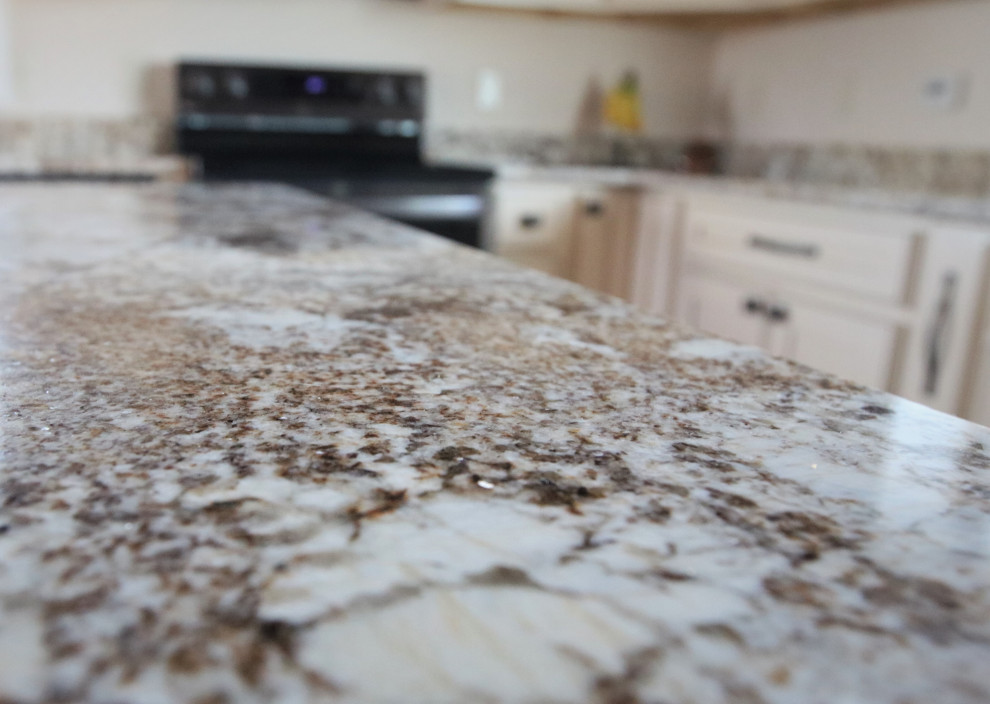 Kitchen - large rustic kitchen idea with an undermount sink, shaker cabinets, granite countertops, an island and multicolored countertops
