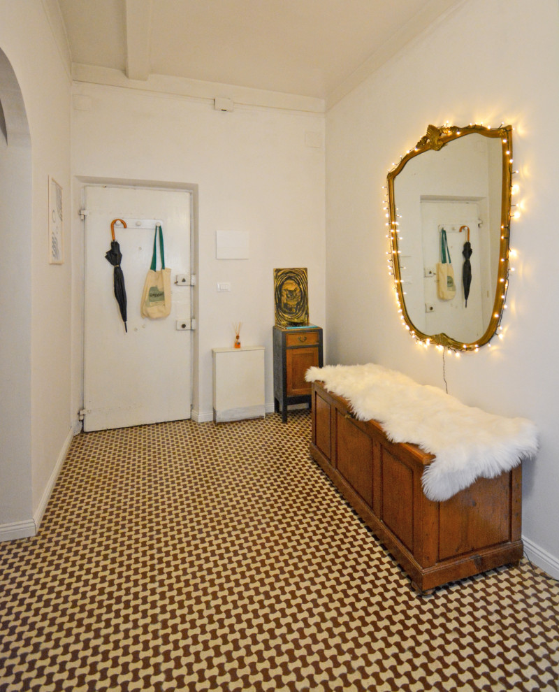 Mid-sized transitional ceramic tile entryway photo in Florence