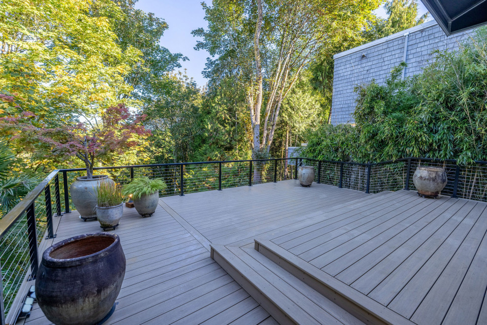 Inspiration for a mid-sized backyard second story cable railing deck remodel in Seattle