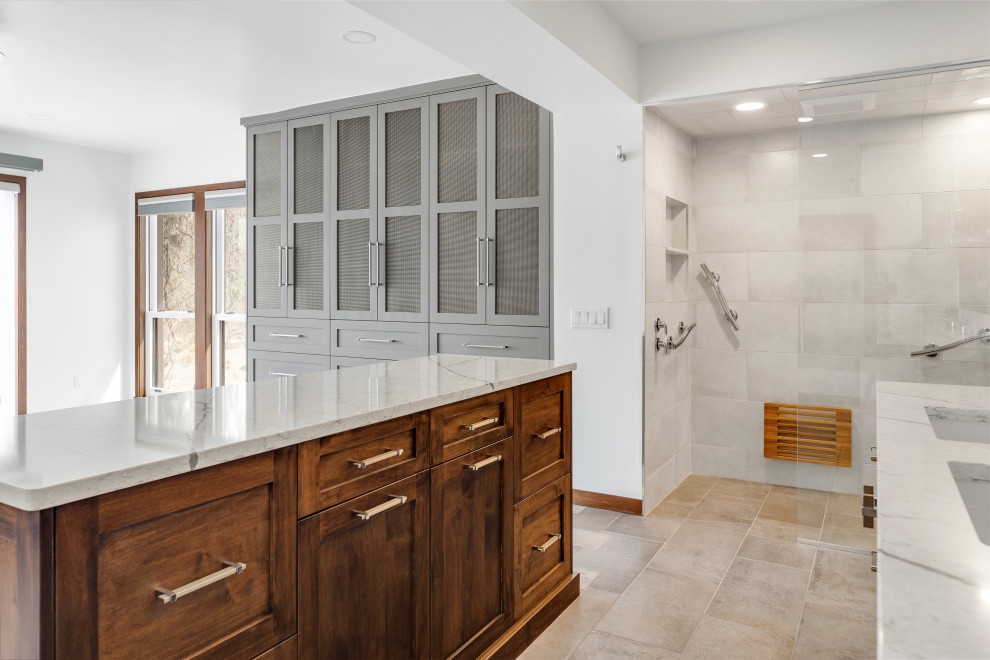 This is an example of a large contemporary master bathroom in Detroit with recessed-panel cabinets, brown cabinets, a curbless shower, a one-piece toilet, gray tile, porcelain tile, white walls, porcelain floors, an undermount sink, engineered quartz benchtops, grey floor, an open shower, white benchtops, an enclosed toilet, a double vanity and a floating vanity.
