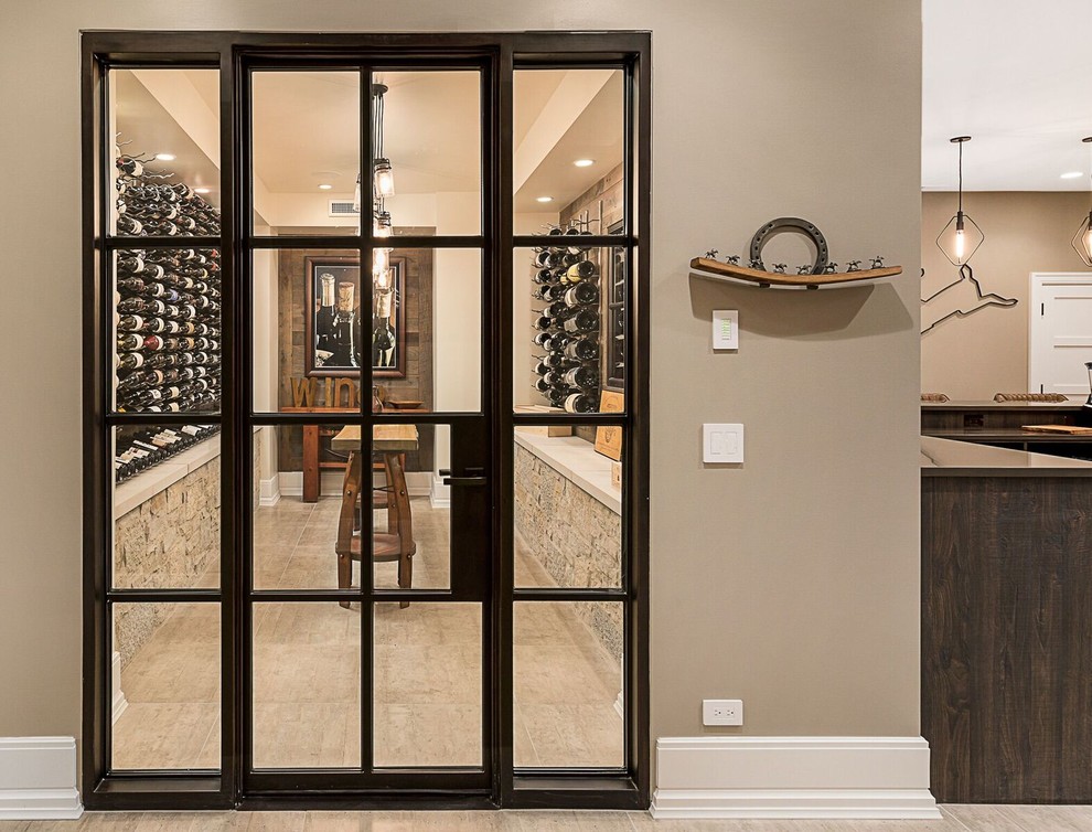 Photo of a mid-sized traditional wine cellar in Chicago with porcelain floors, display racks and beige floor.