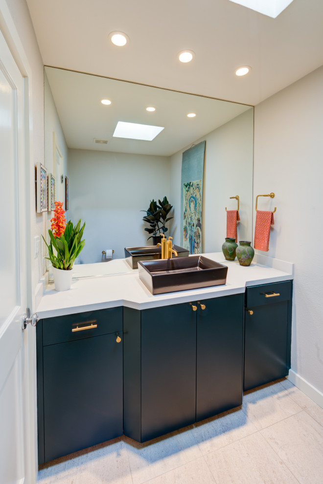 Midcentury powder room in San Francisco with louvered cabinets and purple cabinets.