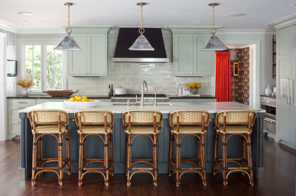 Inspiration for a large transitional l-shaped dark wood floor enclosed kitchen remodel in Denver with an undermount sink, beaded inset cabinets, gray backsplash, stainless steel appliances, an island, green cabinets, quartz countertops and subway tile backsplash