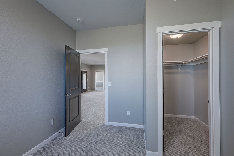 Example of a transitional bedroom design in Seattle with gray walls