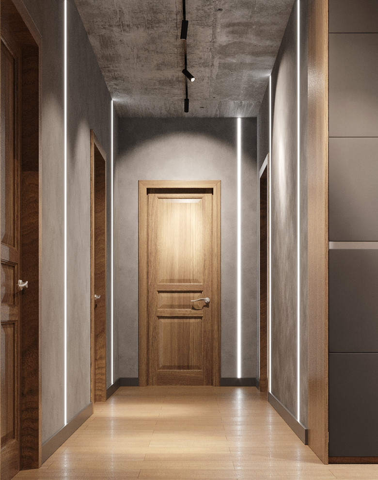 Esempio di un ingresso o corridoio contemporaneo con pareti grigie, pavimento in legno massello medio e pavimento beige