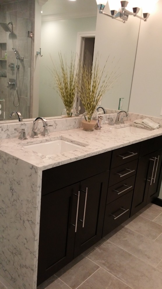 Large contemporary master bathroom in Other with a corner shower, shaker cabinets, black cabinets, a drop-in tub, gray tile, porcelain tile, blue walls, porcelain floors, an undermount sink, granite benchtops, beige floor, a hinged shower door and white benchtops.