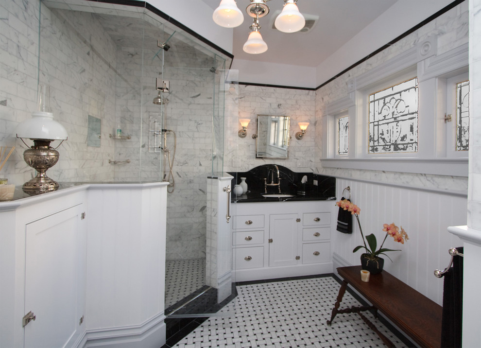 Photo of a mid-sized traditional master bathroom in San Francisco with an undermount sink, white cabinets, granite benchtops, a corner shower, white walls, marble floors, shaker cabinets, white tile and stone tile.