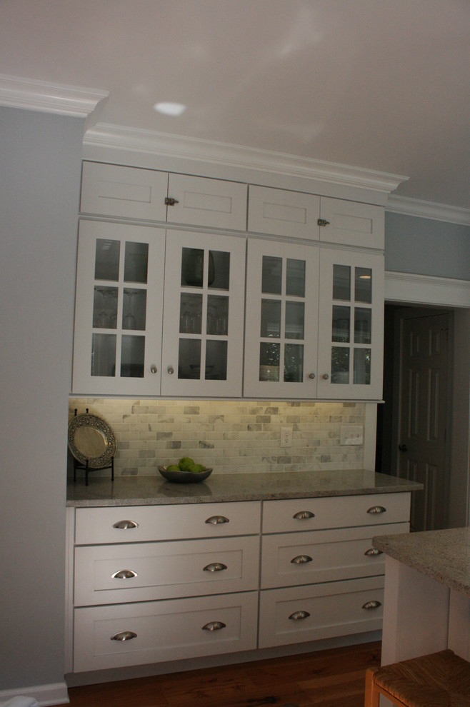 Transitional kitchen photo in Nashville with flat-panel cabinets, white cabinets and granite countertops