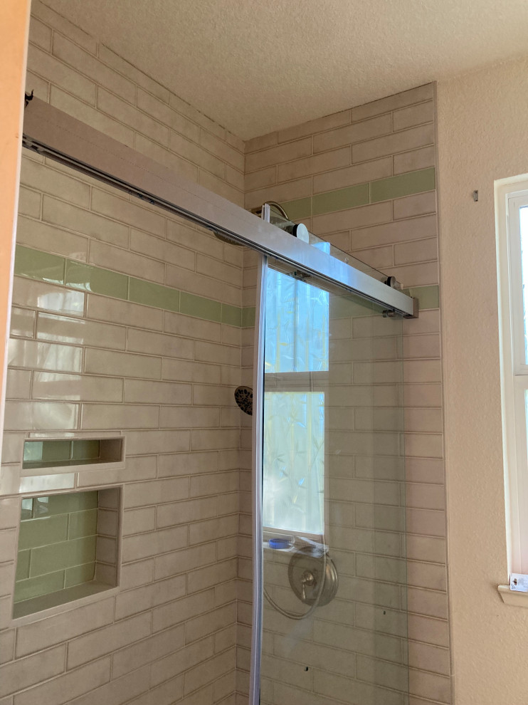 Shower door on glass tile