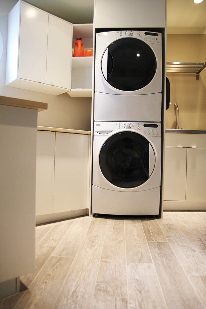Photo of a large contemporary laundry room in Seattle with porcelain floors.
