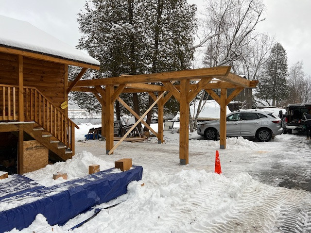 Log Siding, Stamped Concrete and Post and Beam Carport