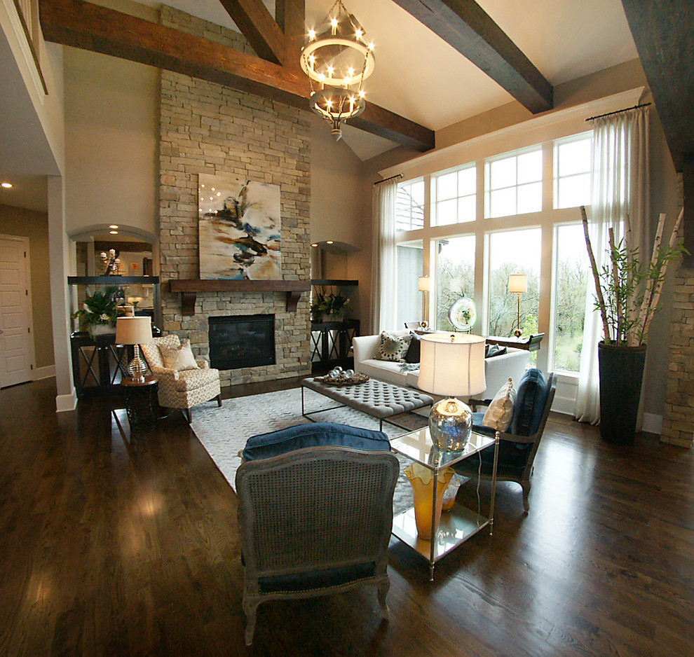 Large transitional formal open concept living room in Kansas City with beige walls, dark hardwood floors, a standard fireplace, a stone fireplace surround and no tv.