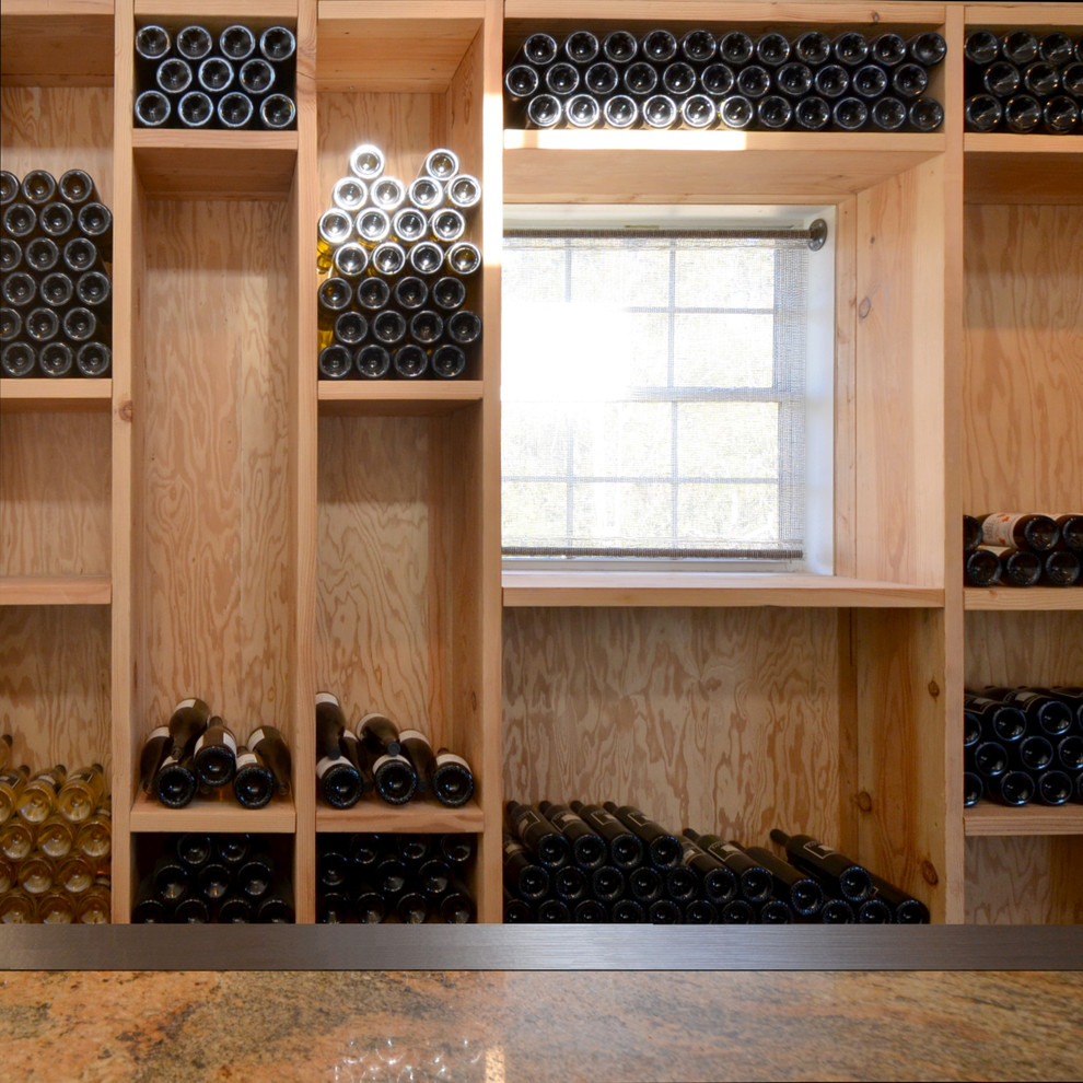 Mid-sized transitional wine cellar in San Francisco with concrete floors.