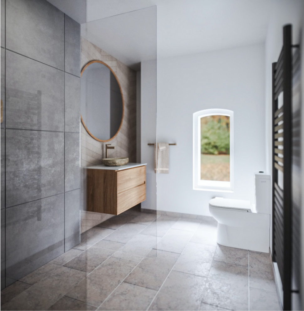This is an example of a medium sized scandi bathroom in London with flat-panel cabinets, light wood cabinets, a one-piece toilet, grey tiles, ceramic tiles, grey walls, limestone flooring, a vessel sink, marble worktops, grey floors, an open shower, beige worktops, a feature wall, a single sink and a floating vanity unit.