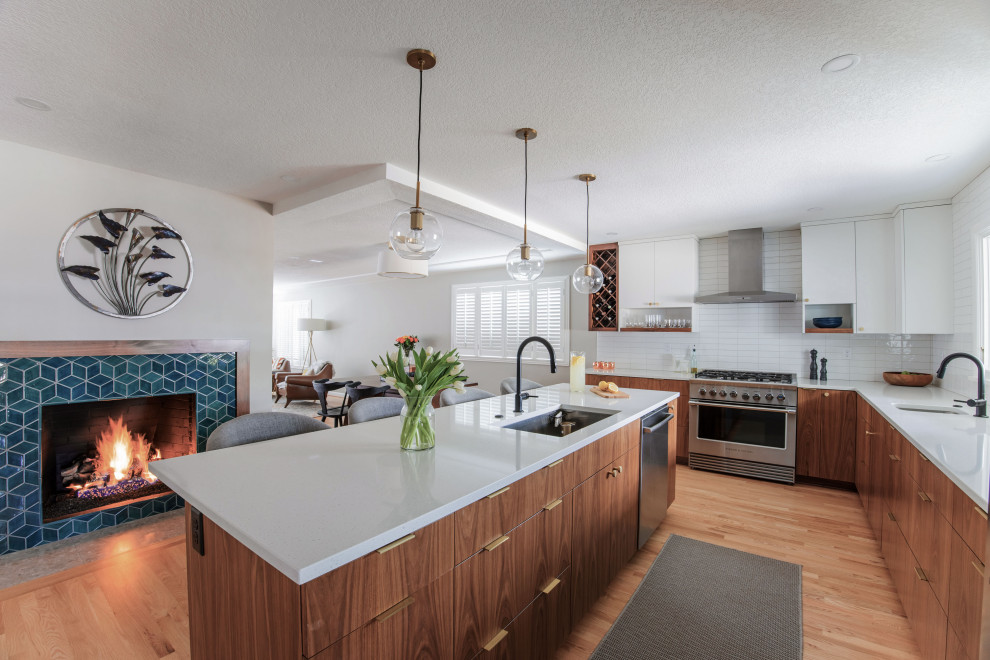 Example of a mid-century modern kitchen design in Portland