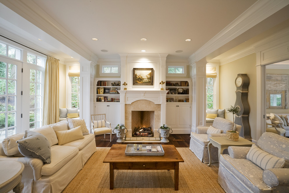 Inspiration for a traditional living room in Portland with white walls and a standard fireplace.