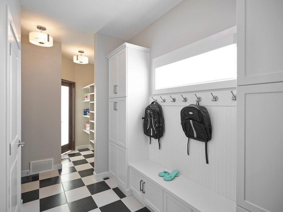 This is an example of a contemporary mudroom in Edmonton with multi-coloured floor.