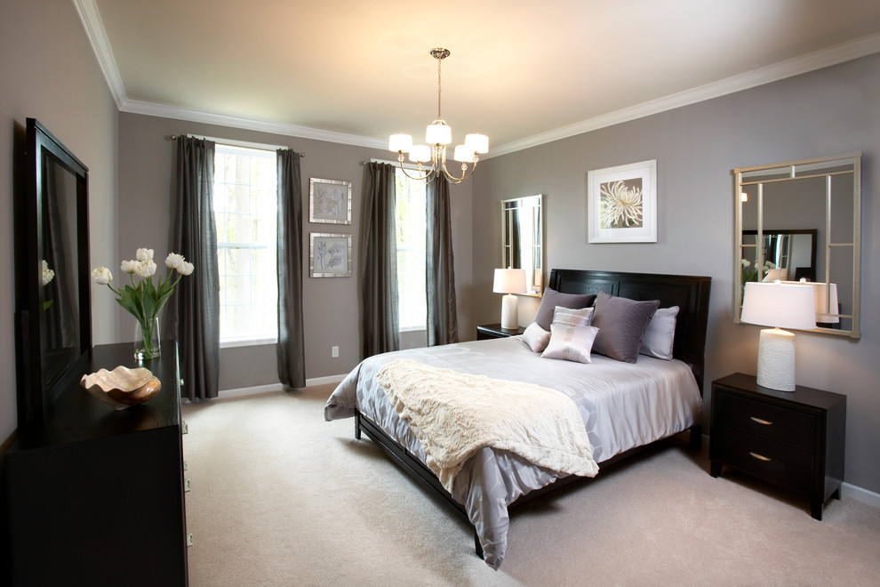 This is an example of a mid-sized transitional master bedroom in New York with grey walls, carpet and no fireplace.
