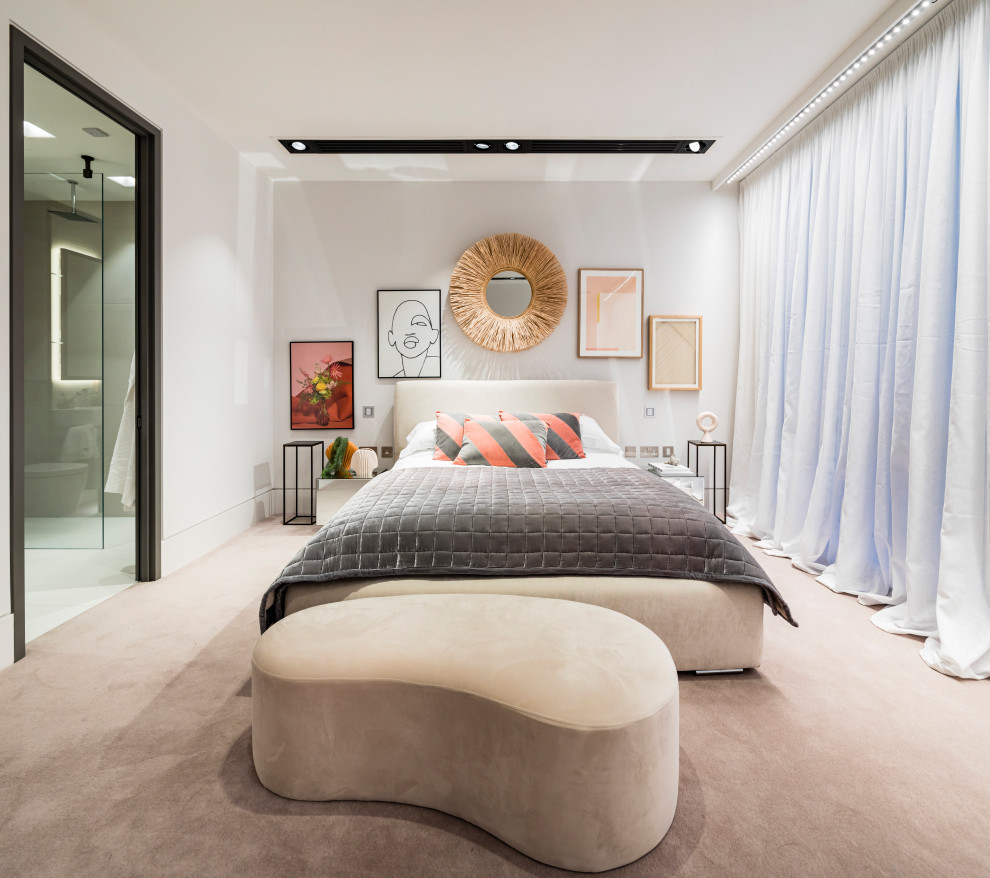 Photo of a contemporary bedroom in London with grey walls, carpet, no fireplace and beige floors.