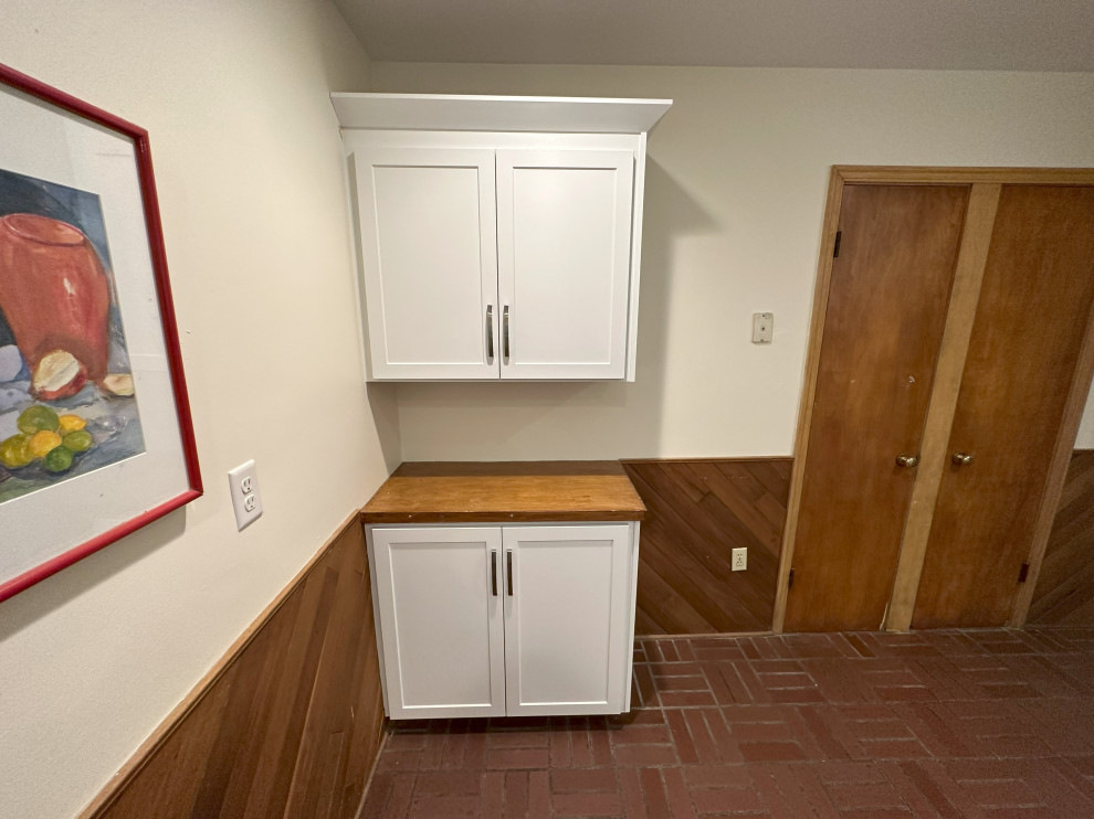 Example of a small transitional l-shaped eat-in kitchen design in Other with shaker cabinets, white cabinets, laminate countertops and subway tile backsplash