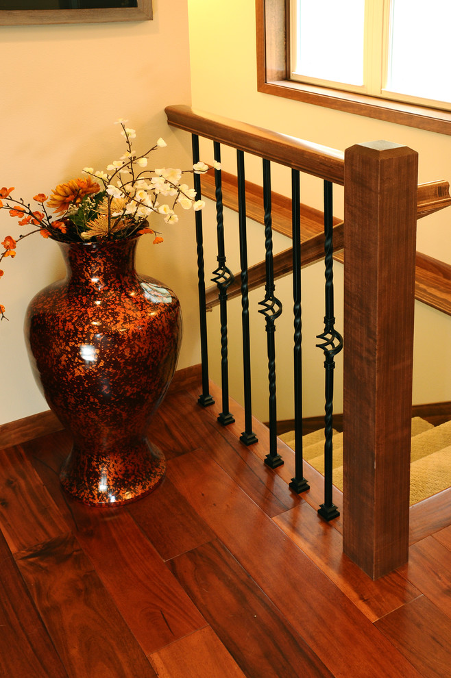 Traditional carpeted l-shaped staircase in Other with carpet risers.