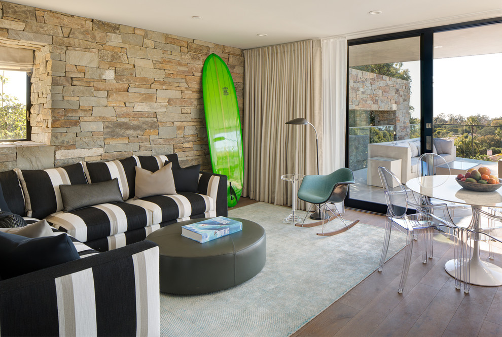 Inspiration for a large modern enclosed dark wood floor and brown floor game room remodel in San Diego with white walls