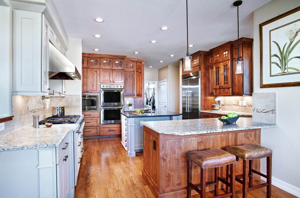 Example of a transitional kitchen design in Denver