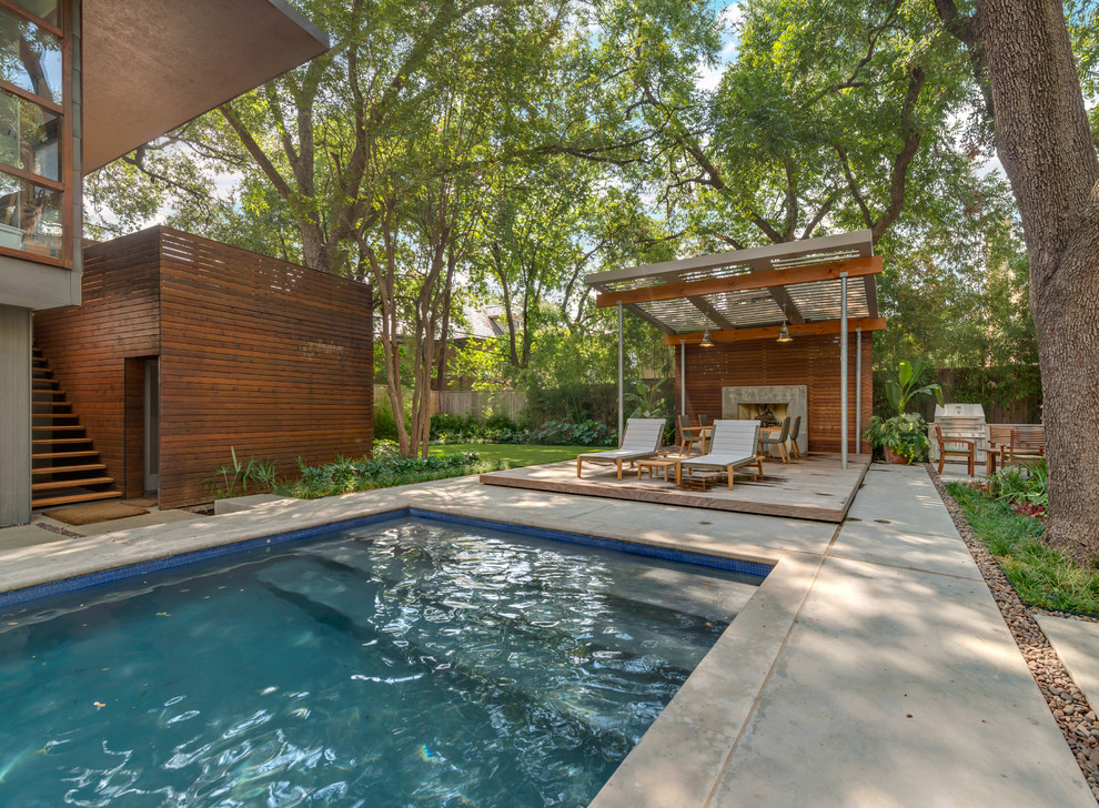 Photo of a contemporary pool in Dallas with decking.