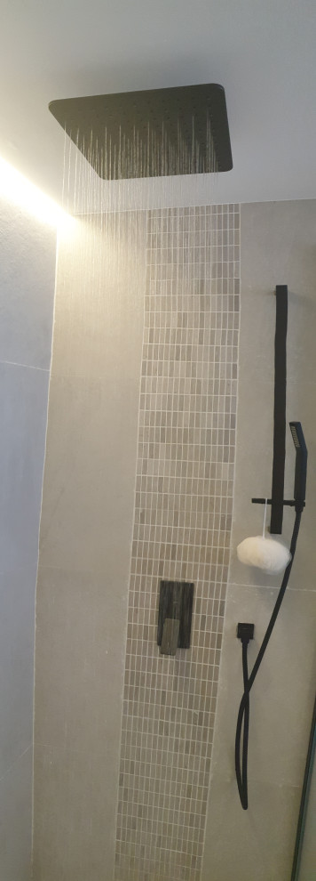 Freestanding bathtub - mid-sized modern master gray tile and ceramic tile ceramic tile and gray floor freestanding bathtub idea with flat-panel cabinets, beige cabinets, a one-piece toilet, gray walls, a console sink, granite countertops, a hinged shower door and black countertops