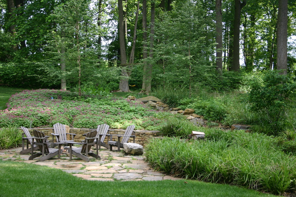 Design ideas for a patio in Philadelphia with natural stone pavers and no cover.